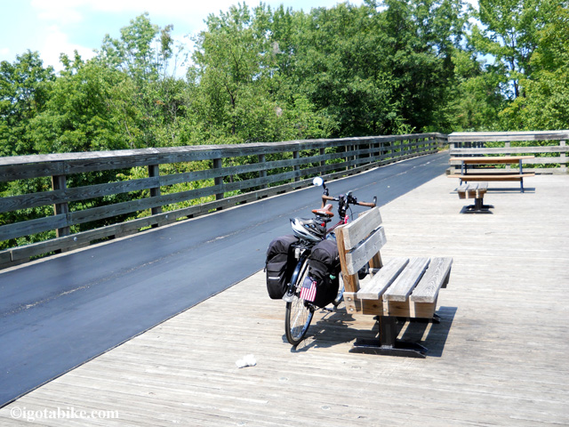 South of Rock Creek is a high railroad trestle with a viewing deck with a picnic table and benches and a fatastic view. The bridge is covered in some sort of leather or vinyl material. 