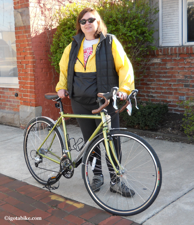 Here's Carol outside the bike shop after purchasing a new 2010 Jamis Aurora touring bike in April 2012.     Wow! What a pretty bike!