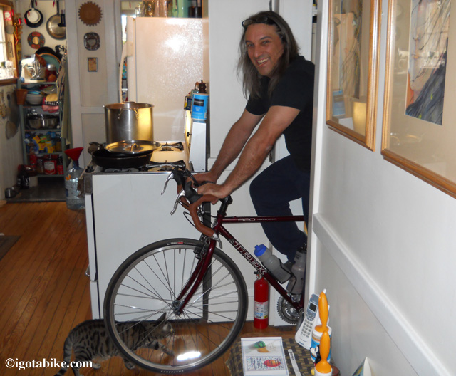 Here's Guy just after getting his just purchased second hand Trek 520 back from the bike shop with a tune-up, new chain and cassette, bar tape, Brooks saddle, a few cables and other parts making the bike like new. Its still winter in April when you live in Cleveland so Guy is checking the fit in our kitchen. 
