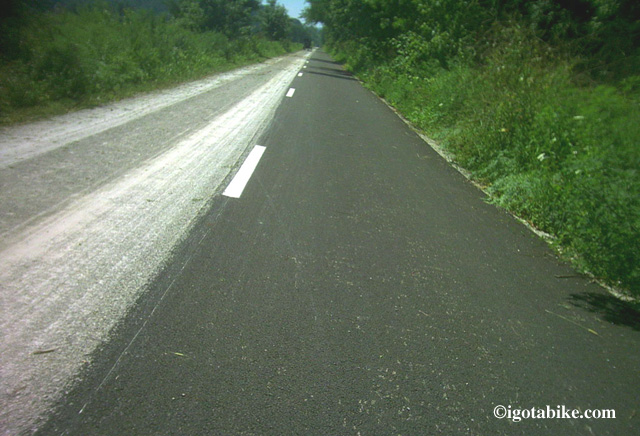 The Holmes County Trail used to have a dramatically different pavement type for horses and bikes. This photo from 2005 has an Amish buggy approaching in the distance.