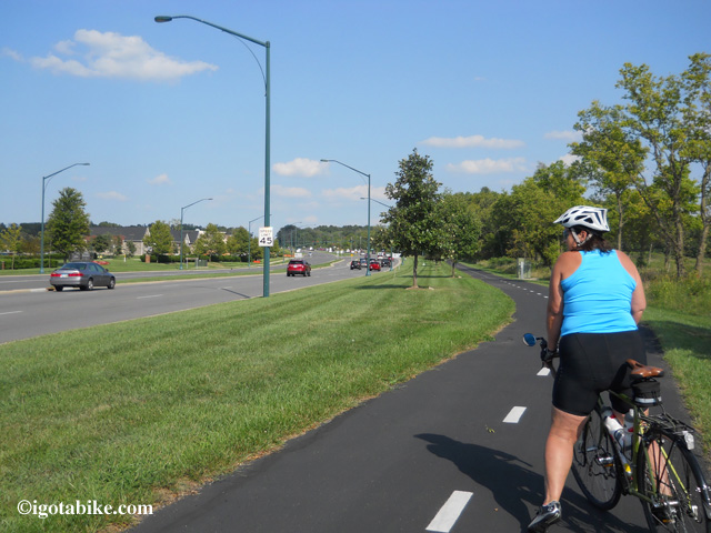 The bike trail on the south side of Maxtown Road / Polaris Parkway which connects to the Alum Creek Trail via Cleveland Avenue. In this photo Carol is facing east, following the northbound Ohio to Erie Trail.