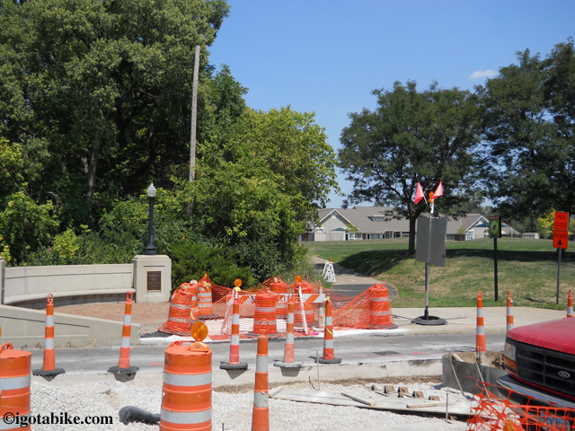 In August 2012 the bridge crossing West Third Avenue along the Olantangy Trail was under contruction. Continue north following the detour around the block, and after construction continue through the tiny Harrison North Park pictured here.