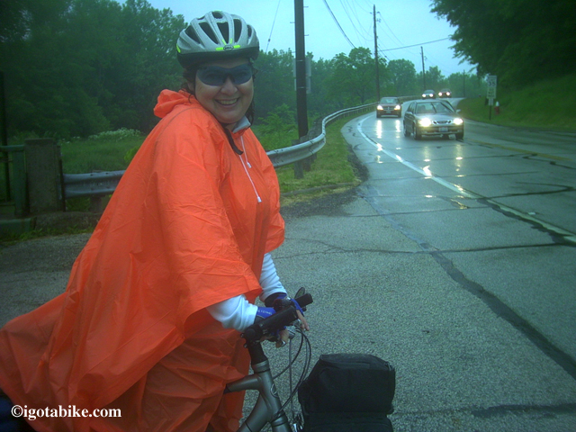 A cheap old fashioned drug store ponchos is compact, disposable, and readily available.